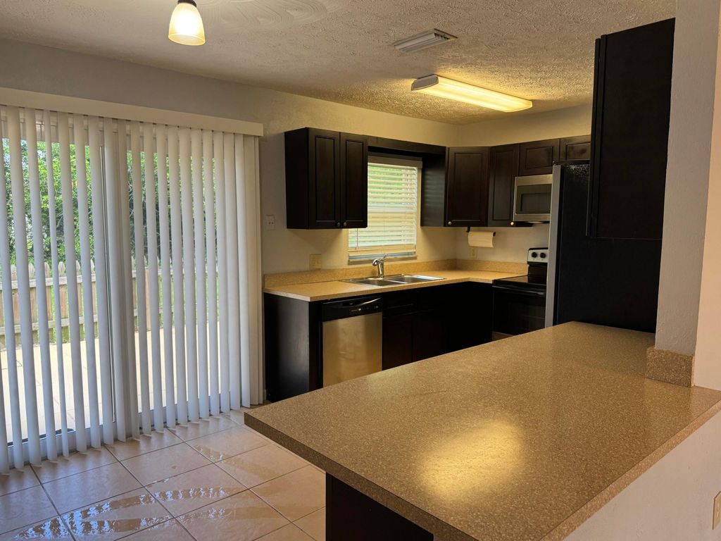 Photo of 1841 SW Mcallister Lane, Port Saint Lucie, FL 34953 (MLS # B26033106)