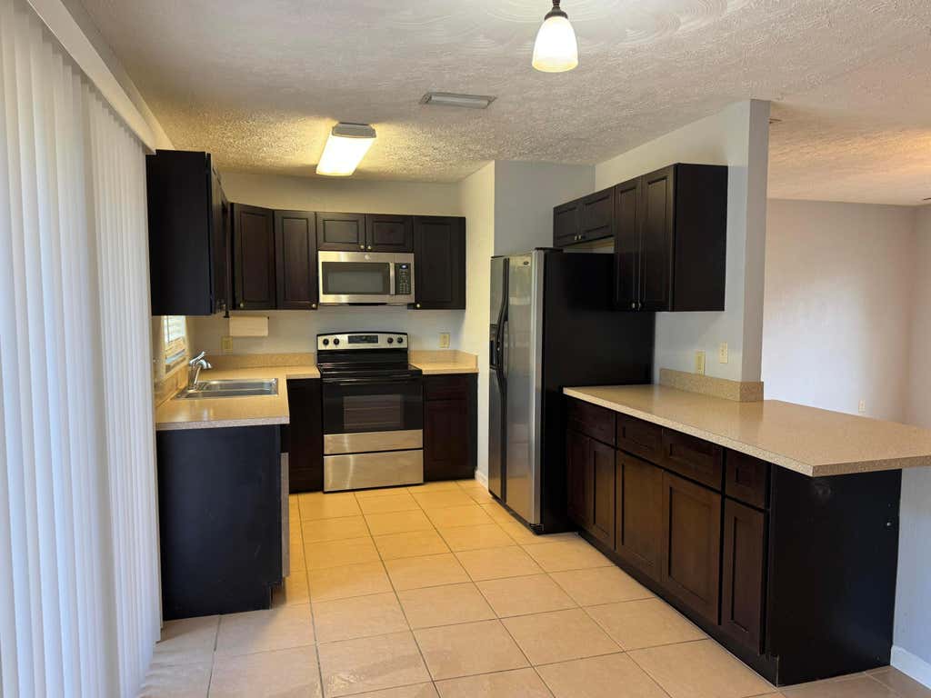 Photo of 1841 SW Mcallister Lane, Port Saint Lucie, FL 34953 (MLS # B26033106)