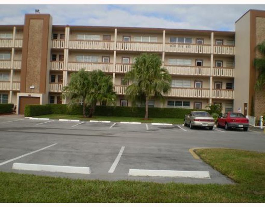 Completely redone second floor unit. Newer kitchen and baths. Immaculate. Directly across from pool. View from terrace looks out at the newly renovated tennis courts with a glimpse of the lake and roll ups on patio. Wood laminate flooring up to bedrooms which are carpeted. Patio doors from each bedroom. Tile in kitchen with stainless steel appliances.There are sliding doors going to patio from each bedroom.