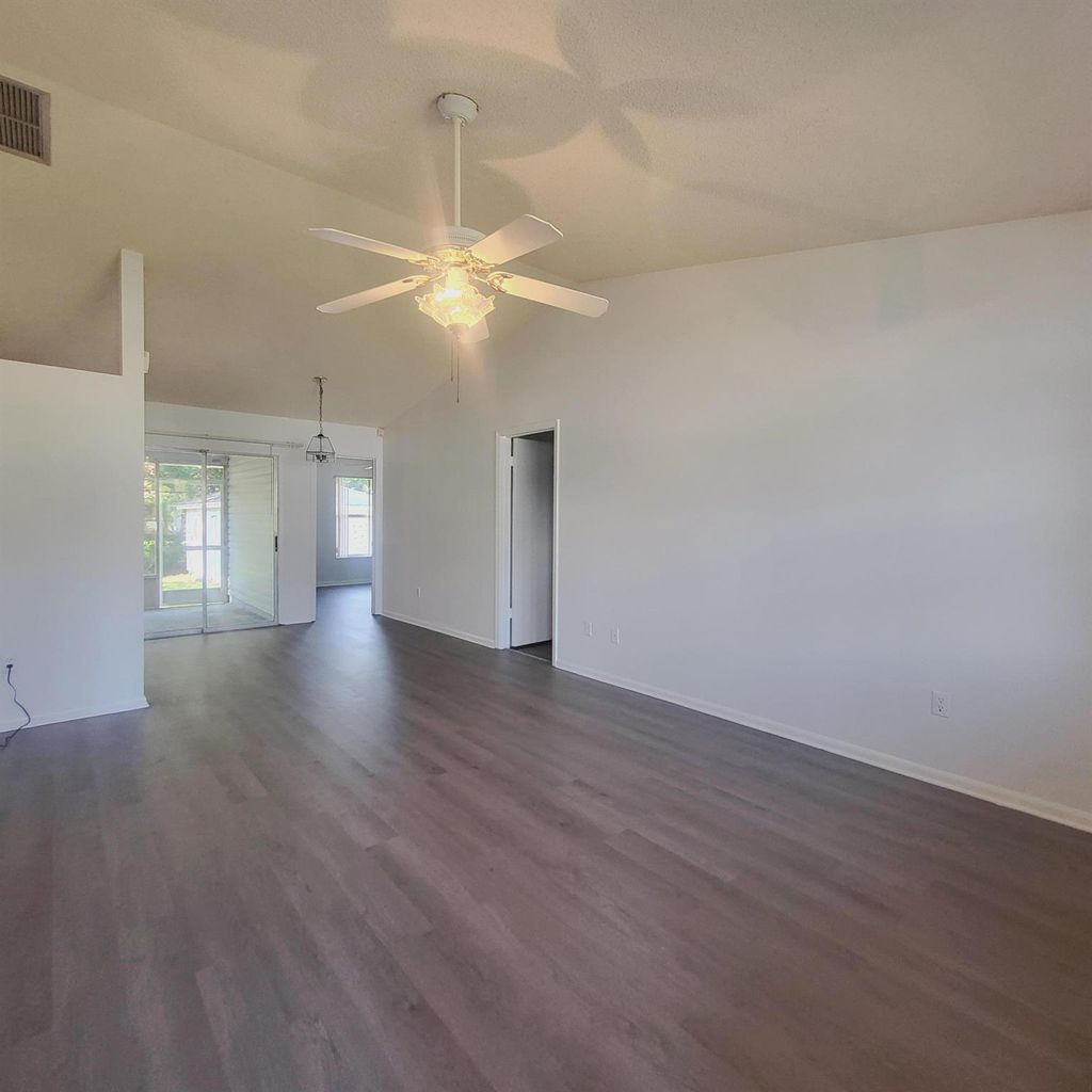 Photo of 719 SW Arkansas Terrace, Port Saint Lucie, FL 34953 (MLS # R11013499)