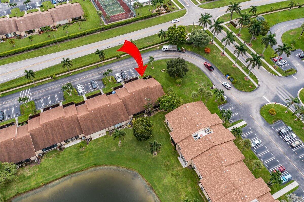 CORNER UNIT..ALL AGES VILLA. WELL MAINTAINED CORNER UNIT WITH LAKE VIEW AND RECENTLY RENOVATED. Updated Kitchen, bathrooms, Maytag stainless steel appliances, porcelain tiles throughout, tankless water heater plus complete accordion shutters. AC including condenser recently replaced with warranty. This BEAUTIFULLY WELL-KEPT VAULTED CELILING VILLA HAS IT ALL. UNLIKE OTHER VILLAS IN THE COMMUNITY. THIS LIGHT AND bright home has a large screened in patio with a separate AC unit. Also Washer and Dryer is located in a large utility room within the patio instead in the kitchen like others in the community. Everything has been TASTEFULLY UPDATED. Community offers extensive amenities including pool and tennis/pickleball. Come check this one out.