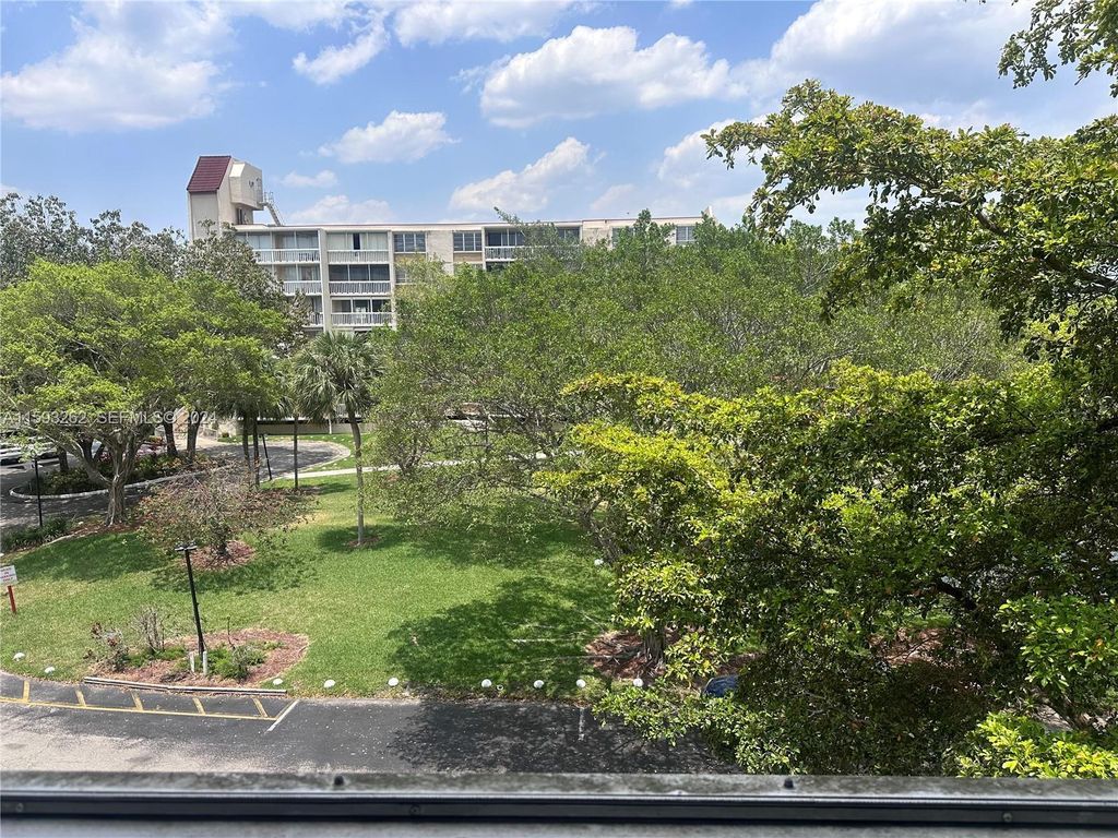 Photo of 7021 Environ Boulevard #317, Lauderhill, FL 33319 (MLS # B26005459)