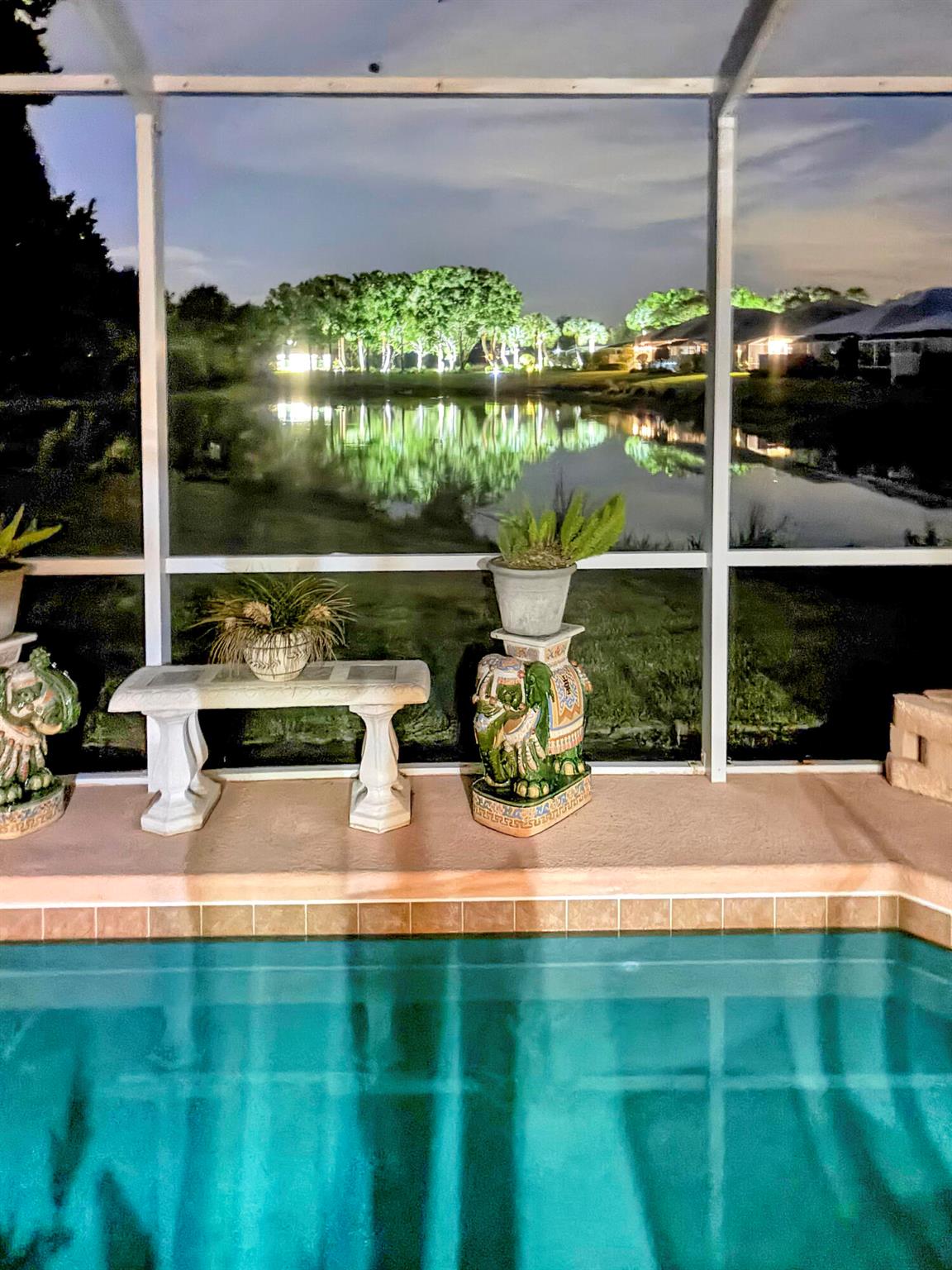 Enjoy Florida living at it's finest in this exceptional home within the desirable gated community of Willoughby Cay. On a quiet cul de sac, this 2-bedrooms plus a den (optional 3rd bedroom) offers additional privacy with a split bedroom floor plan. The security of a CBS structure is stylishly enhanced by vaulted ceilings, crown molding and a formal dining room, perfect for entertaining. The kitchen features granite countertops and island with ample cabinetry. A spacious primary suite includes a walk-in closet and serene long pond views. Relax outdoors on the screened lanai overlooking your private pool and the pond with a fountain. Additional features include a laundry room with utility sink, two-car garage, and a new metal roof in 2023. Centrally located in Stuart.