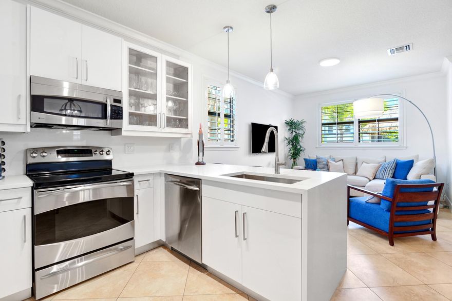 Experience coastal living at its finest in this beautiful 3-bedroom corner townhouse just steps from the beach. This bright, open-concept residence features white contemporary newer kitchen cabinetry and countertops, stainless steel appliances, and custom plantation shutters throughout. Impact windows and doors provide both style and peace of mind. Enjoy the convenience of a spacious 2-car garage and the exclusivity of a boutique gated community. Ideally located on A1A between Commercial Boulevard and Atlantic Boulevard, you'll be just moments from trendy dining, vibrant shopping, and all the best of the beachside lifestyle. Lowest maintenance on the beach!