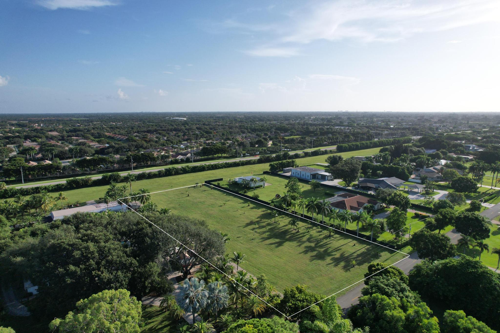 Take off from this community on your private airplane. Purchase this 2.24 acre lot and build your dream home. Exclusive gated community has only 36 lots and a private airstrip for resident use. Site plan and house plans available. Build a 2,000 SF home or larger. Build a hangar up to 5,000 SF in addition to your home. Dogs, cats, chickens and horses allowed for domestic use. In the heart of Delray Beach off Hagen Ranch Road just South of Lake Ida Road, this hidden gem community close to everything is like living ''off the grid'' but with access to major highways, shops and restaurants. You don't want to miss this opportunity to own a nice piece of land in the heart of Delray.