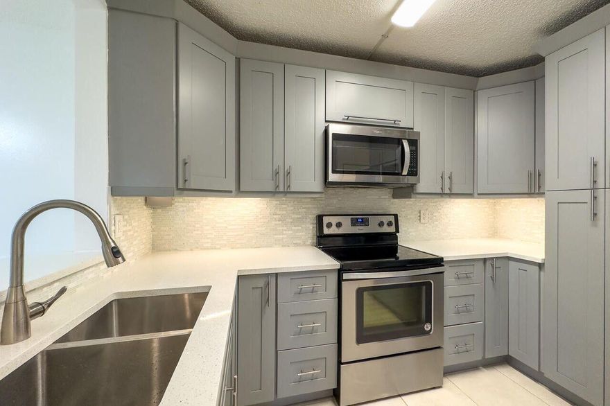 Welcome to one of the most desirable communities in Jupiter! This 2/2 corner condo on the 1st FLOOR. Rent INCLUDES water, lawn, and basic cable. The condo is in a centrally located community with excellent A+ schools, shopping centers, close to golf course, playgrounds, close to I-95 and Turnpike, beaches, a great view, and more! Large screen enclosed porch offers a great area to relax after a long day... The community has a clubhouse with a pool, picnic area, and tennis court.