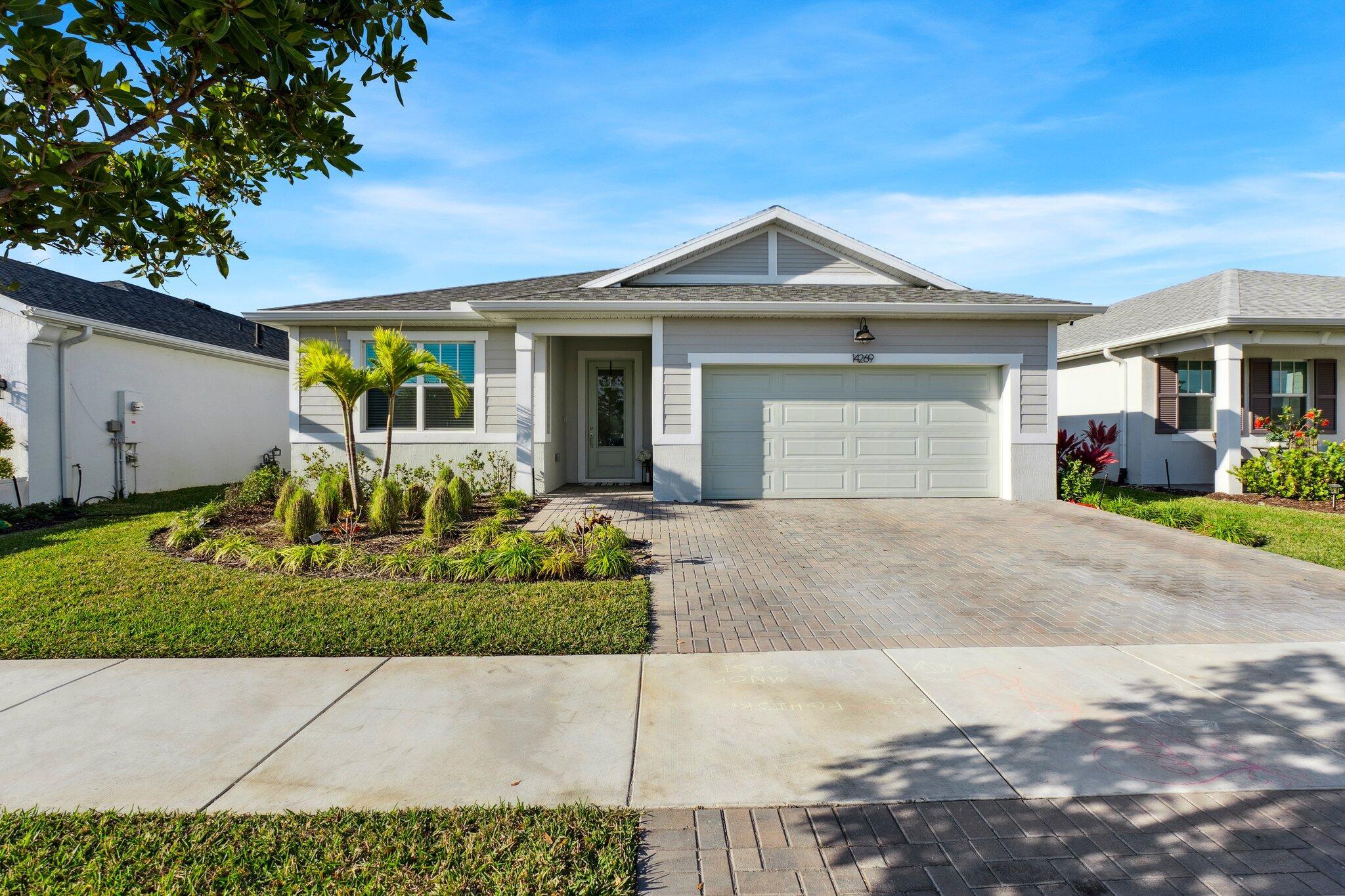 Built in just 2023, this beautiful home offers 4 bedrooms, 2 bathrooms, 2 car garage nestled in the new Tradition community Cadence. Close to A rated schools, parks, major highways, shops & fine dining. Featuring a widened paver driveway, impact windows, tile throughout main living areas, high ceilings, gorgeous stone accent wall with electric fireplace, the open floor plan perfect for entertaining. The kitchen is adjacent to the living room & offers quartz countertops, island, stainless steel appliances, gas stove, shaker soft close cabinets and pantry. Spacious master suite with walk-in closet, dual sinks, and nice size tiled shower. The large backyard has plenty of room for a pool & a screened paver patio.
