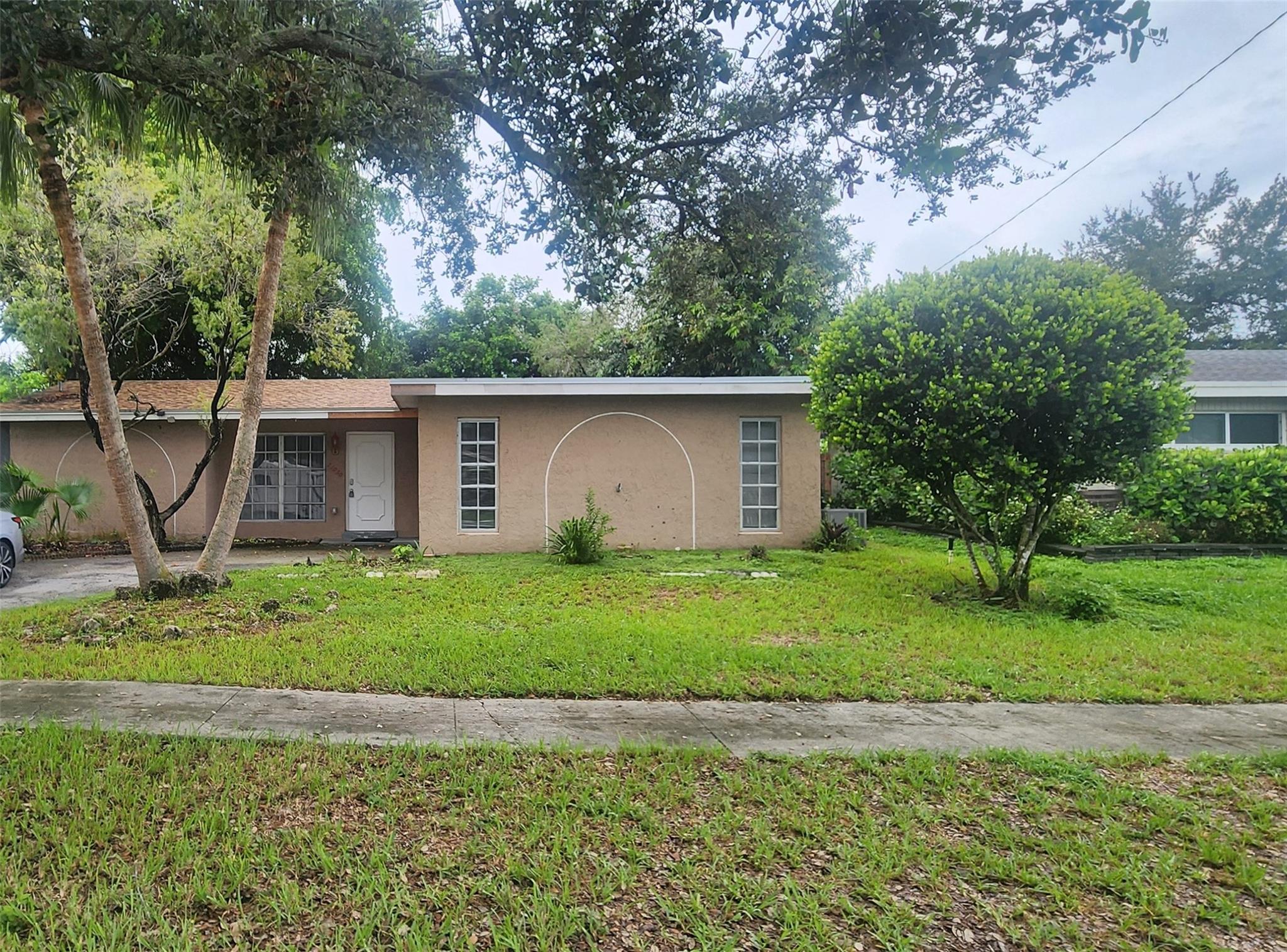 This Sunrise Golf Village home offers a practical single-story layout with two bedrooms and two bathrooms on a fenced lot. Inside, you’ll find
updated luxury vinyl flooring, ceiling fans, and a bright kitchen with essential appliances in place. The circular driveway and attached garage add
convenience, while the backyard provides space for outdoor living. With public water and sewer service, no HOA, and a location near major
roadways, shopping, and dining, this home is a versatile option for both investors and homeowners looking for value in Sunrise.