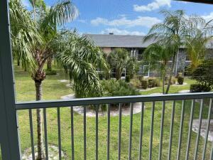 COME SEE A GEM OF A VIEW. Priced to sell!! 2 bed 1.5 bath in a 55+ very active community in Martin County. Apt has a wall unit Murphy bed, desk and storage in the 2nd bedroom. 4 new ceiling fans, screened in Lania with east and west exposure, close access to clubhouse, pool & 1st tee. Brand new roof in 2023 & assessment already paid in full by owner.9-hole golf, pool, pickleball, tennis, bocce ball and clubhouse. Close to beaches, shops, restaurants, I95 & Turnpike, PBI airport. Fiber optics cable with internet & blue stream channels included in monthly condo fees.