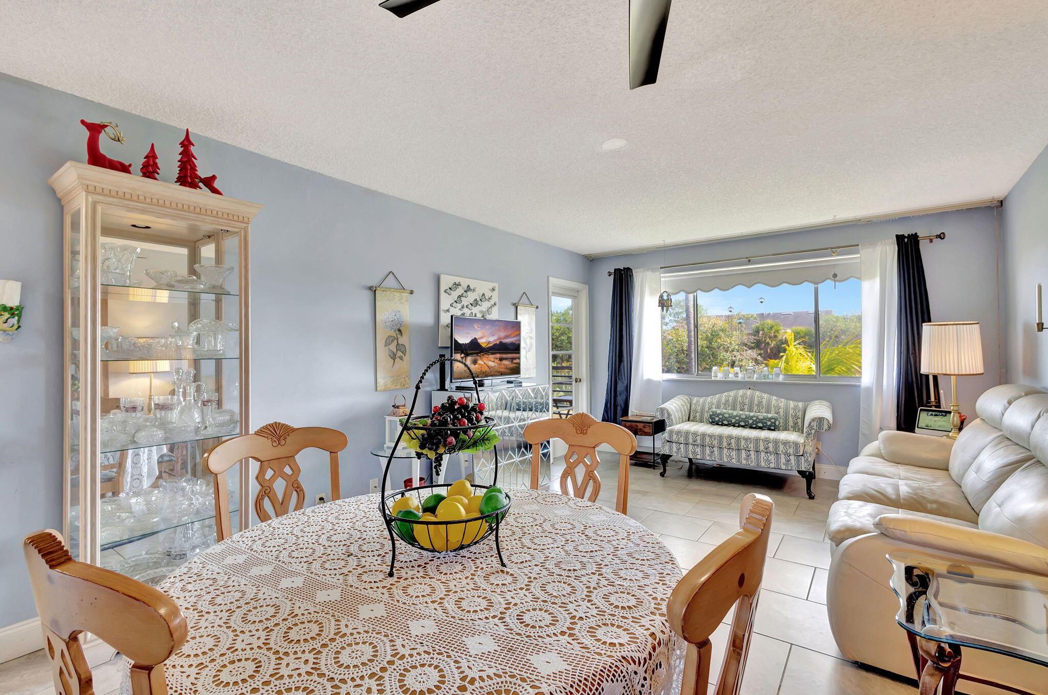 MONTHLY FEE WAS JUST REDUCED BY OVER $200/MONTH TO $619.18!!! A brand-new bathroom, consistent flooring & water view distinguish this unit at Lake Clarke Gardens. An LED-framed mirror & new lighting fixtures modernize the floor plan. Access the balcony from both the bedroom & living room. The location along the perimeter of the community provides a serene canal view & quietude. Stainless-steel appliances in the kitchen. This unit has full storm protection with accordion shutters & the electrical panel has been upgraded.Lake Clarke Gardens has 2 heated pools flanking a massive community lake. The amenities by the main pool include a community room, theater, putting green, shuffleboard & fitness center. Management is on site. There are courtesy buses. This is a very active community with