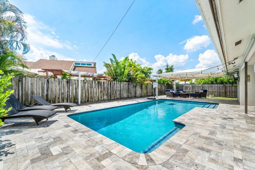 This beautiful 4-bedroom, 2-bath heated pool home is located on a spacious corner lot in the heart of Wellington. The property features an expansive, fenced-in backyard with generous covered seating areas perfect for relaxing or entertaining year-round. Nestled in a peaceful, private neighborhood with no HOA or gate, this 1/4-acre lot offers both privacy and convenience. The home includes a 2-car garage and is available annually, furnished or unfurnished or seasonally furnished. Lawn care and pool maintenance are included in the lease. Pets are considered on a case-by-case basis with a pet fee. Just minutes from the WEF showgrounds, Global Dressage, and Polo, this home provides quick access to top-rated restaurants, schools, grocery stores, and a renowned hospital.