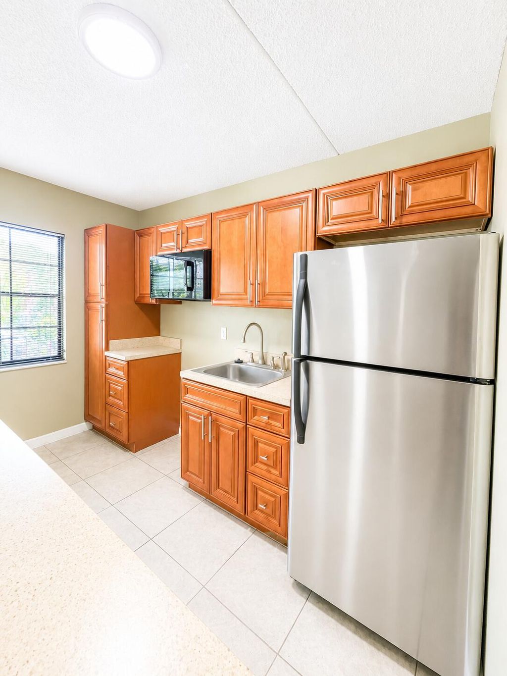 Photo of 1508 NW Avenue D #B10, Belle Glade, FL 33430 (MLS # B26029886)