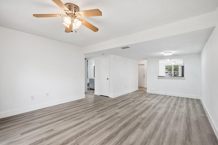 Spacious townhome with new waterproof vinyl flooring throughout, and new bathroom vanities. Freshly painted, and brand new washer/dryer on the second floor.  Ideal layout for renters or families, with the primary suite on entry level and additional bedrooms upstairs. Each bedroom upstairs has its own sink area with shared access to the main bath. The kitchen, which is fully equipped with an electric oven, refrigerator, dishwasher and over-the-range microwave. Private balcony access from upstairs, perfect for morning coffee. Impact windows and doors installed. Located near to a beautiful park and the community pool. HOA fee covers the roof,  master insurance policy for the buildings structure, and landscaping. The pool area, and common grounds maintenance including trash removal. The HOA covers the roof, landscaping, and the master insurance policy for the building structure. Also covers the pool area and maintenance of the entire subdivision.