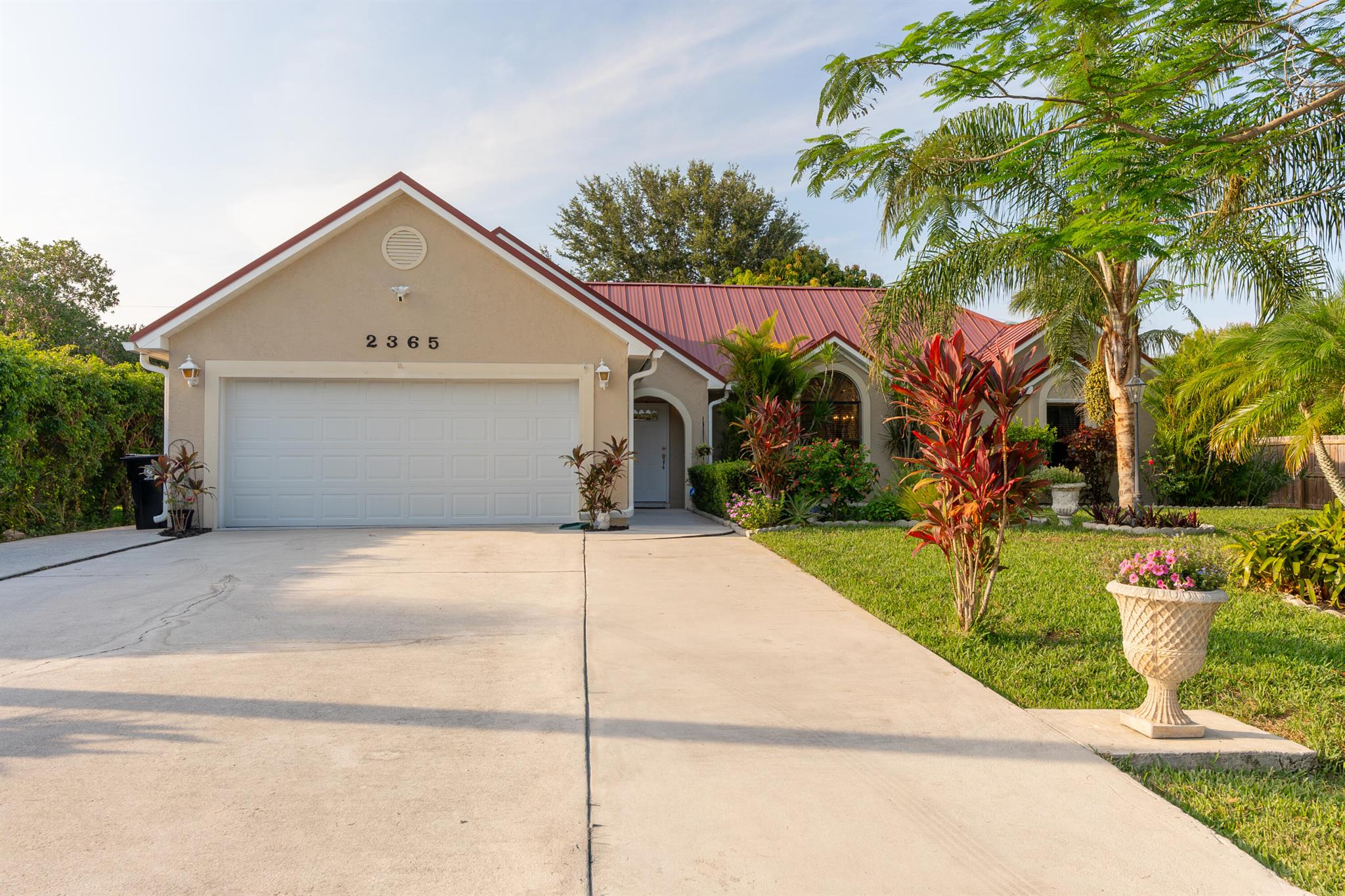 Listed 55K Under a Recent Appraisal! Bring Your Boat, RV, and Toys to This East Port Stunner! Welcome To This Beautifully Updated/Maintained 4-Bedroom w/ Den, 3-Bath, 2-Car Garage CBS Lake Front Home --A True Gem in the Most Desirable East Port St. Lucie Neighborhoods. No HOA! Enjoy The Freedom to Make the Most of your Property. This Home Features Brand New Standing Seam Colonial Red Metal Roof, Remodeled Kitchen and Bathrooms, Open Floor Plan, Vaulted Ceilings, Split Bedroom Layout, Extra-Large Bedrooms. Close To Shopping, Civic Center, Hospital, Parks, Wildlife Center, Hutchinson Island Beaches & Downtown Stuart. Only 6 Miles To Hutchinson Island Beaches. Call Today