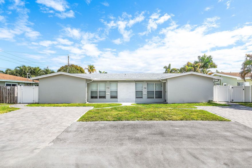 Fully renovated duplex located east of Federal Highway in Pompano Beach. This rare side-by-side property features two spacious 2BR/1BA units, each offering 1,000+ SF, private entrances, and individually fenced backyards. Both units have been updated top to bottom with modern open kitchens, quartz countertops, stainless steel appliances, tile flooring, updated bathrooms, fresh landscaping, and white PVC privacy fencing. Each unit includes a full-size washer and dryer and is separately metered. Ample driveway parking, storm protection with a mix of impact windows and shutters, and recent major improvements including a new driveway and roof. No HOA. Prime location minutes to the beach, A1A, Pompano Pier, parks, dining, shopping, and major highways. Ideal turnkey investment or to house-hack!