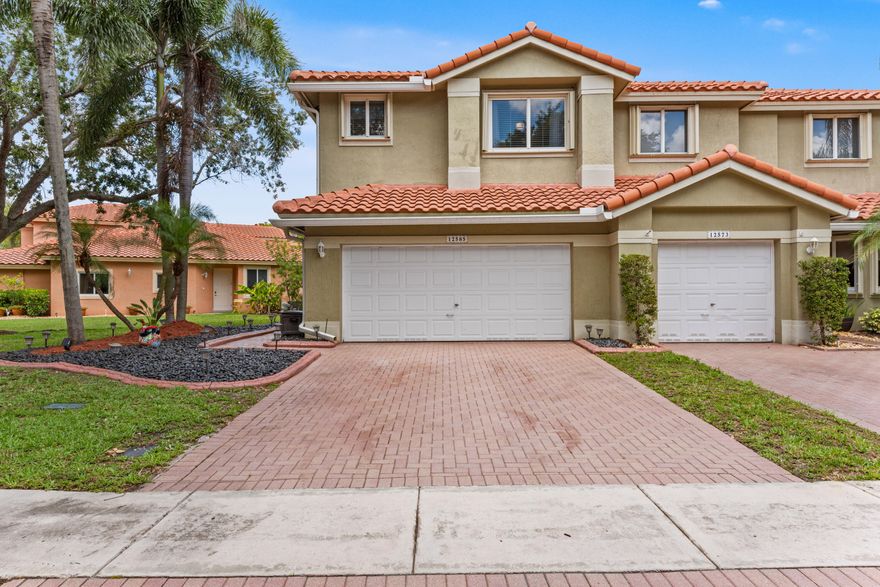 Come see this corner unit in the Fairways, a super quiet, gated & safe neighborhood, one of Heron Bay's most desired locations. Pet & kid friendly. Enjoy the spacious feel with soaring ceilings paired with expansive full-height windows. Light cascades throughout. The oversized open patio provides ample outdoor living space, perfect for entertaining. Assoc. allows the option to screen in. Huge side yard offering unmatched privacy & peaceful nature views. Space to breathe, room to live! Mature trees & minimal landscaping means low maintenance. Meticulous owner has updated big ticket items, Roof 2020, A/C 2021, Ductwork cleaned 2025,  Appliances 2017/2024, Water Htr 2023, Painted 2026, Full Hurricane Shutters. Beautiful crown moulding throughout. Annual rentals allowed. Love where you live!
