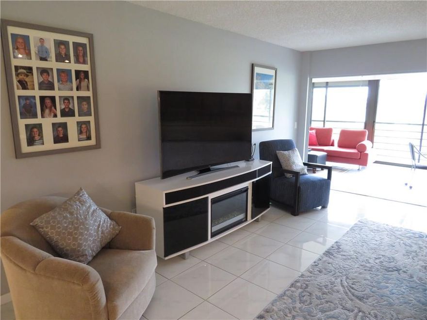 Beautifully remodeled large 2/2 golf view condo on 3rd floor. Tile in all living areas & kitchen. Bedrooms are carpeted. Both bathrooms remodeled with large showers. Huge lanai with storage at both ends, bar, and golf course view. All stainless appliances with eat-in kitchen. Large interior storage room and exterior individual locker storage by elevator. Single reserved covered parking spot with ample guest parking.Country club living with no membership requirement. 55+, no pets, or any leasing.