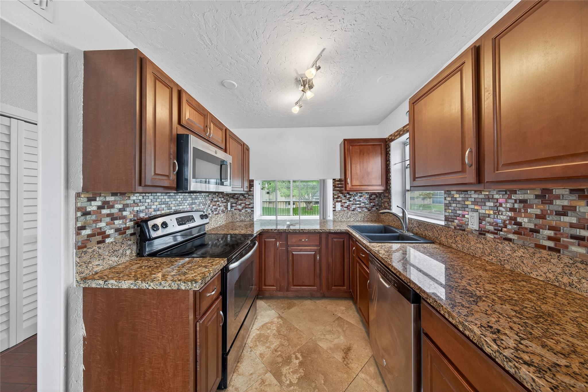 Move-in ready renovated corner unit on the second floor, this beautiful 2-bedroom, 2-bath condo in the sought-after 55+ Bermuda Club offers lake view from a private screened patio. Featuring an updated kitchen and baths, tile and vinyl flooring, walk-in closets with brand new doors, and plenty of natural light. . Community is close to shopping, restaurants, transportation and major highway. Enjoy resort-style amenities including heated pools, club house, tennis, gym, billiards, and more, with convenient access to major roadways. With extra storage, assigned parking, and a peaceful setting, this move-in ready gem won't last long! 670 Mininum Credit Score, HOA requires 20% dow