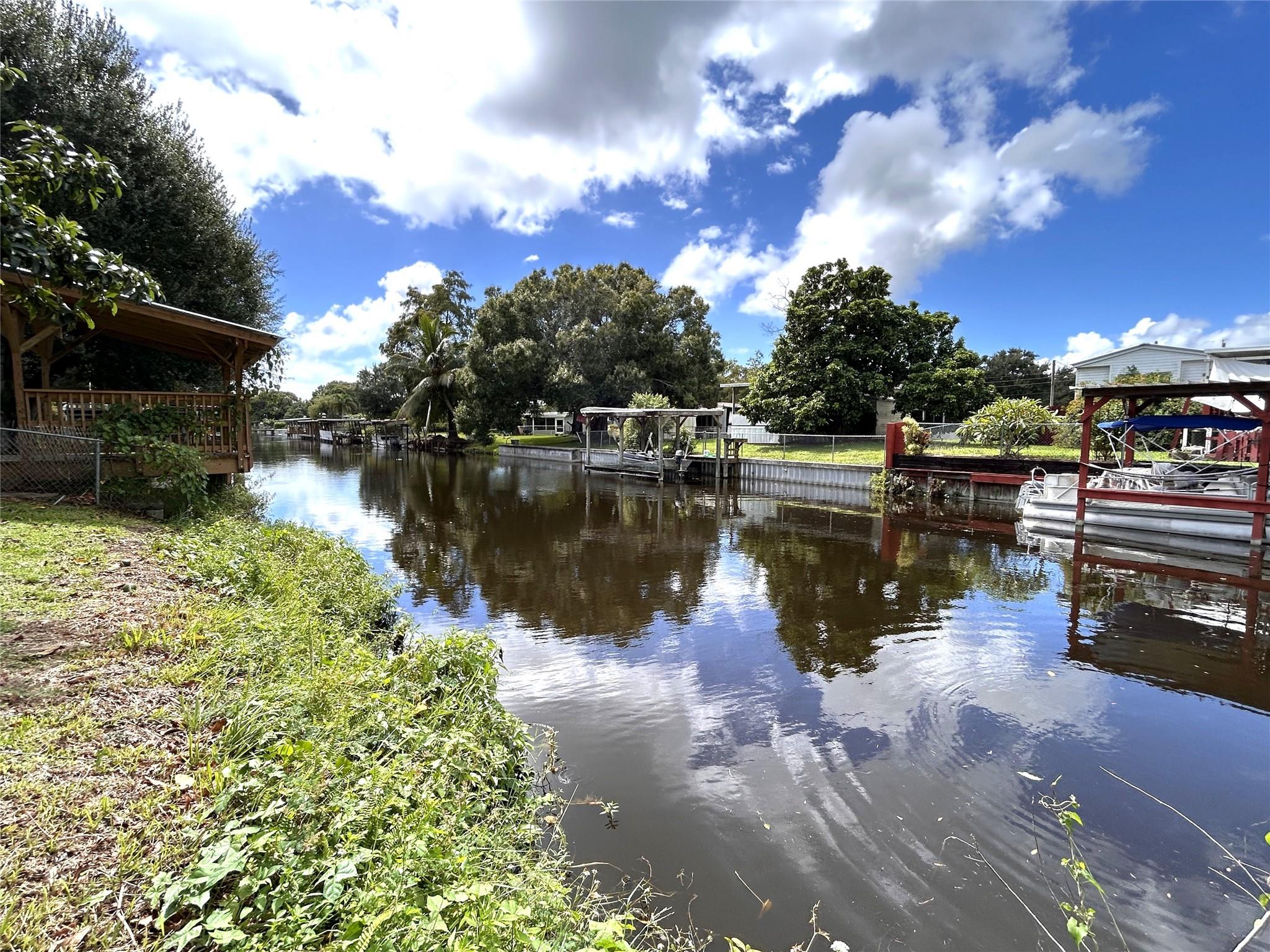 Waterfront canal lot cleared with direct access to Lake Okeechobee. City water, electric and Xfinity cable. This serene homesite is located on a paved public dead end street for a quiet peaceful home with a beautiful water view. No HOA.  The Proximity to Lake Okeechobee offers natural beauty, boating, fishing, walking, etc. for a relaxed Florida lifestyle. This property is zoned residential mixed and will accept various housing types such as single-family home, manufactured home or Double wide Mobile home. Either modest or upgraded, you decide. This lot has a mature avocado tree which provides shade and fruit. This is a lifestyle opportunity.