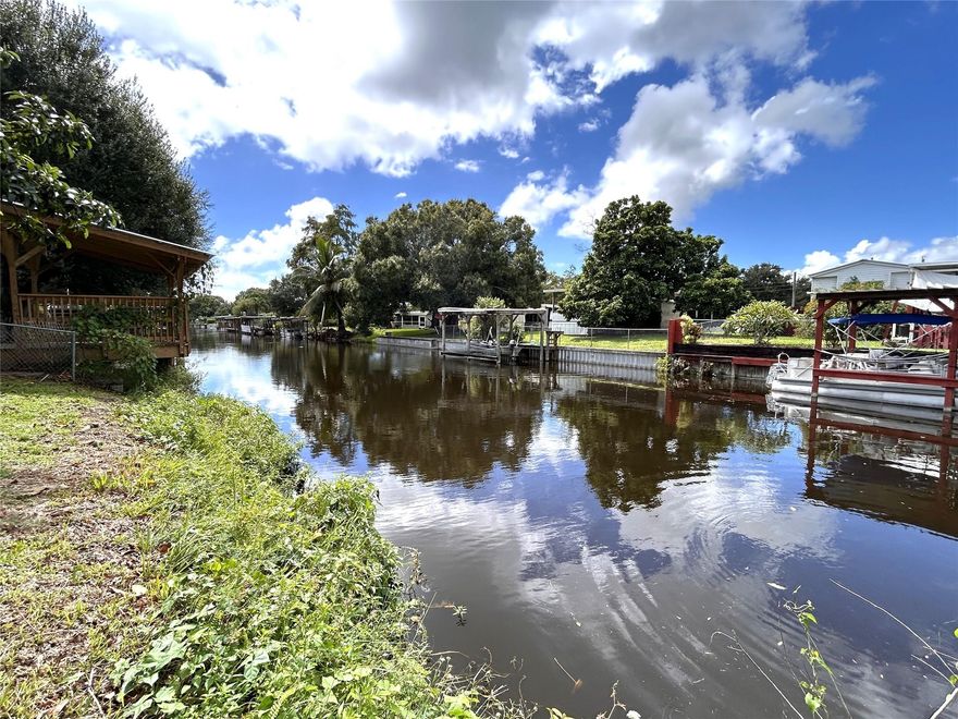 Waterfront canal lot cleared with direct access to Lake Okeechobee. City water, electric and Xfinity cable. This serene homesite is located on a paved public dead end street for a quiet peaceful home with a beautiful water view. No HOA.  The Proximity to Lake Okeechobee offers natural beauty, boating, fishing, walking, etc. for a relaxed Florida lifestyle. This property is zoned residential mixed and will accept various housing types such as single-family home, manufactured home or Double wide Mobile home. Either modest or upgraded, you decide. This lot has a mature avocado tree which provides shade and fruit. This is a lifestyle opportunity.