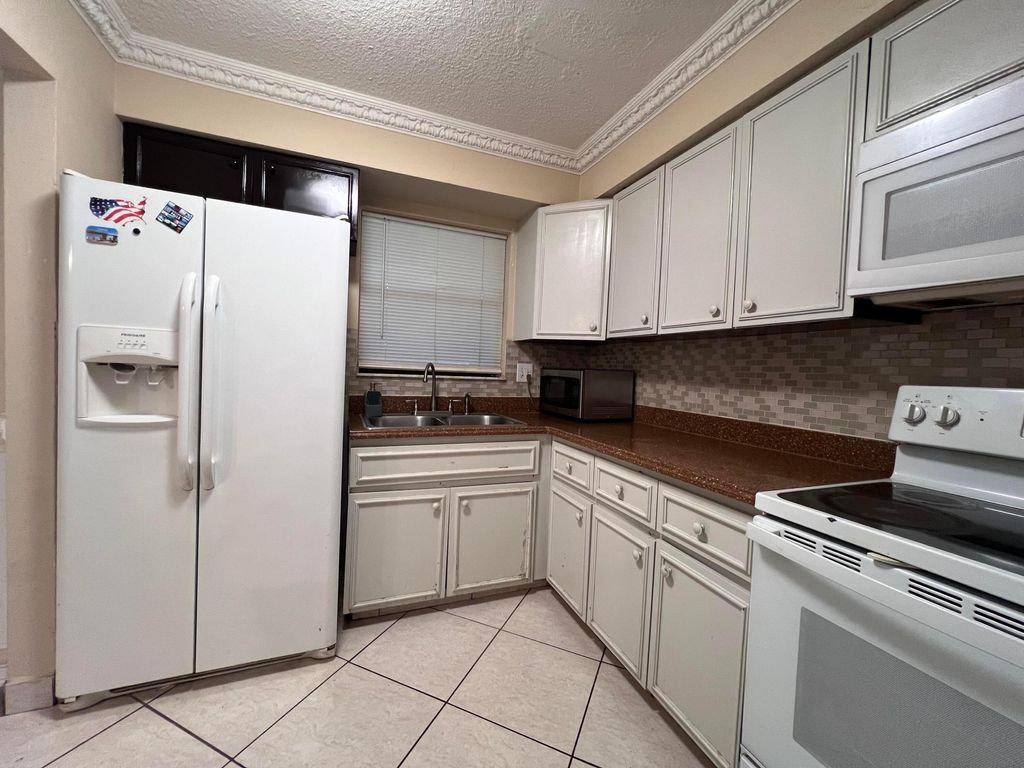 Photo of 5202 Bayside Drive #5202, Greenacres, FL 33463 (MLS # R11012047)