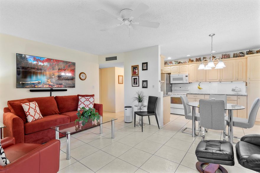 Bright & Airy well-kept 1/1 condo located at Sabal Palm Village in Tamarac, 55+ Community. This immaculate cozy unit is located on the 2nd floor, Large open concept kitchen wooden cabinets w/ additional cabinetry, newer quartz counter tops, under cabinet lighting, SS fridge & white appliances. Tile flooring throughout, A/C 2017, W/Heater 2018, Newer impact hurricane windows. Large M/bedroom w/ custom wall closet (great for extra storing) & walk-in. Enclosed patio features impact windows, electric blinds with remote - Can be used as a Den/Office. Laundry room on premises located on same floor, unit comes w/ extra storage. The association offers a clubhouse with library, fitness room, heated pool, BBQ area & tennis courts etc. Secured Lobby. Mins to Turnpike, Shopping Plazas and Restaurants
