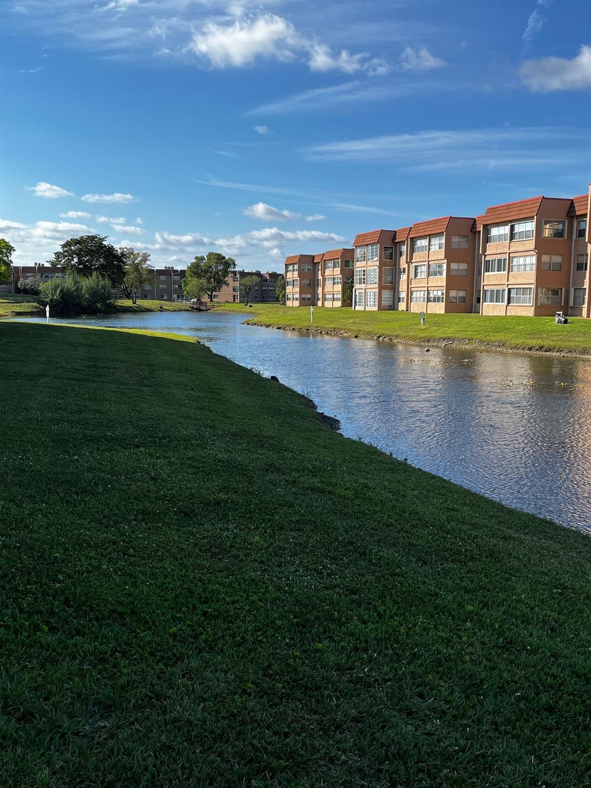 Welcome home to this well kept move-in ready furnished 1st floor 1/1 condo in the active 55+ community of Sunrise Lakes, enjoy a relaxing lake view from your screen porch. The unit features new AC, extra storage on the 3rd floor and much more. Sunrise Lakes is designed to provide a lifestyle of fun,excitement,convenience and luxury for homeowners to enjoy,nine-hole golf course,tennis courts,handball courts, pickle-ball,exercise room, the clubhouse provides amenities,theater, line dancing,sumba, billiard rooms,card rooms,library,and other activities,indoor and outdoor swimming pool,sauna facilities,Tiki huts and outdoor grills, also the community provides pool parties with DJ and Karaoke and more. Conveniently located close to grocery stores, shopping centers,malls and much more. Must see!