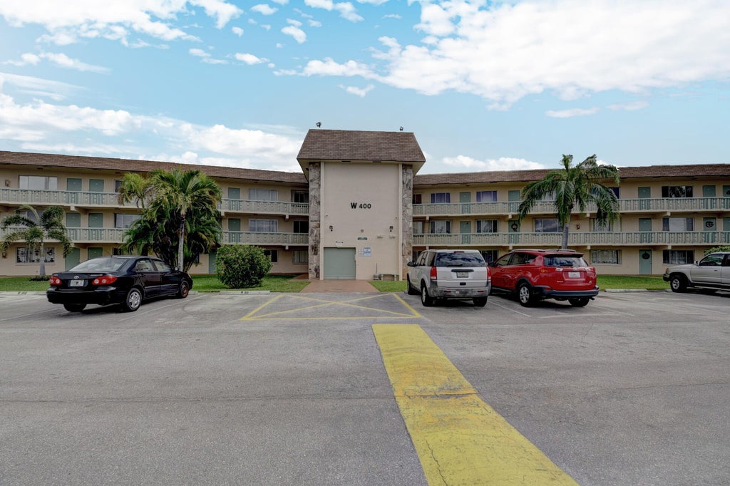 Photo of 400 Village Green Circle W #314, Palm Springs, FL 33461 (MLS # B26078250)
