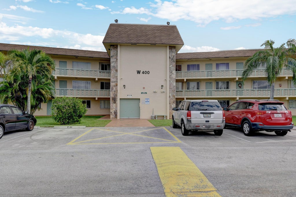 Photo of 400 Village Green Circle W #314, Palm Springs, FL 33461 (MLS # B26078250)