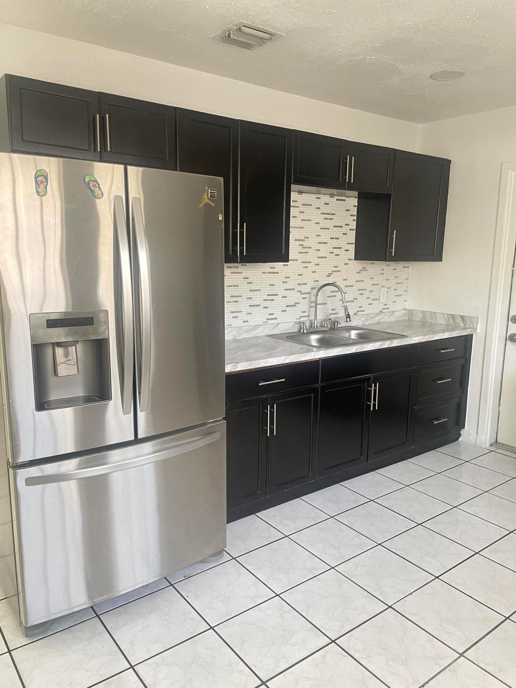 Photo of 5009 Garden Avenue #A, West Palm Beach, FL 33405 (MLS # B26013005)