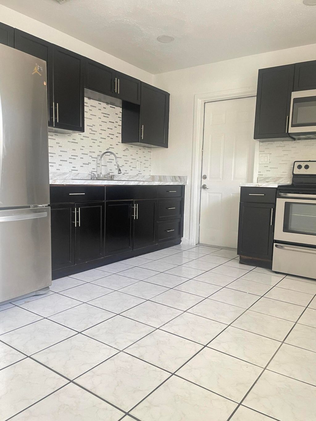 Photo of 5009 Garden Avenue #A, West Palm Beach, FL 33405 (MLS # B26013005)