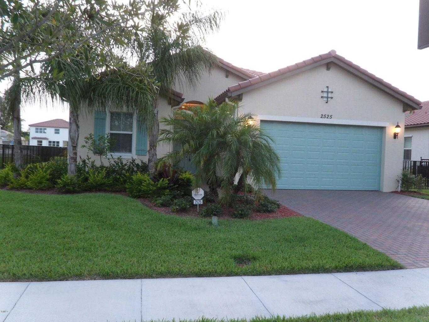 PROPERTY IS UNFURNISHED. Beautifully landscaped lake lot. Open spacious floor plan. Many upgrades including: custom closets in three bedrooms, plantations shutters in kitchen, master bedroom and bath, crown molding, accent lighting in living room, full back splash in kitchen counter area, screened lanai, fenced yard, master bedroom ceiling fan, driveway and lanai has pavers