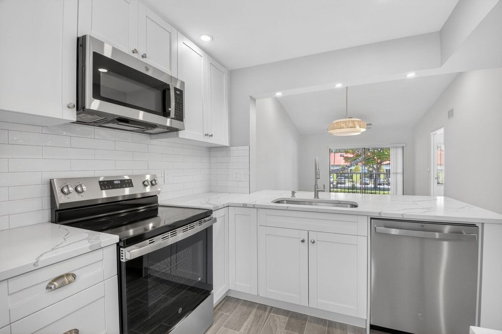 Photo of 6649 Somerset Drive #206, Boca Raton, FL 33433 (MLS # B26025735)