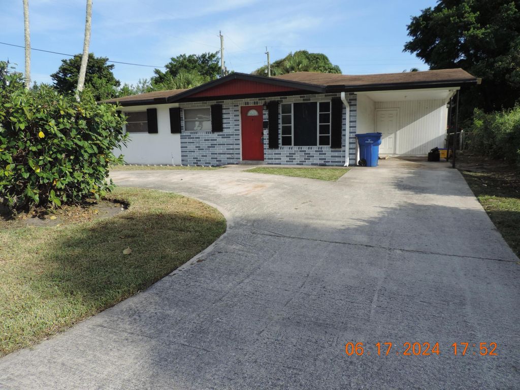 Photo of 1611 W 35th Street, Riviera Beach, FL 33404 (MLS # R10973403)