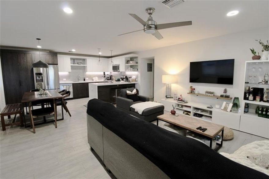 2/2 bright condo with high-end design details. Amazing location, east of US1, in residential neighborhood of Coral Ridge. Fully remodeled unit.All new hurricane windows and doors, porcelain plank floors, solid core doors and high-end door hardware. Large open kitchen w/ soft closed drawers, large single bowl sink, quartz countertops, peninsula with waterfall and glass backsplash. Quiet dishwasher, electric range and convection-micro hood that works as a second small oven. Built-in cabinet with washer and vented dryer.Guest bath with marble countertops and tub with glass shower enclosure. En-suite master bedroom with large master bathroom with double sinks and double hampers, walk-in shower with rainhead and personal handheld and full shower glass enclosure. Custom made built-in closets.