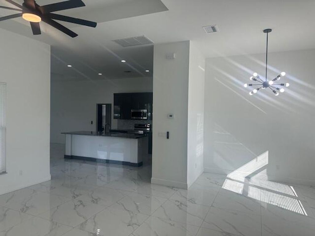 Photo of 1726 SW California Boulevard, Port Saint Lucie, FL 34953 (MLS # R11130197)