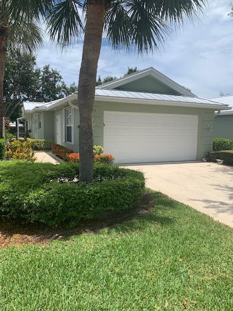 Concrete construction, gated and guarded. 2 bedrooms, 2 bathrooms, 2 car garage with private pool and lake view.Screened in patio and lanai. Move in condition.Community pool, tennis and pickleball courts, children's play area. Conveniently located close to downtown Stuart, PBI airport, I-95, Florida Turnpike and beaches.