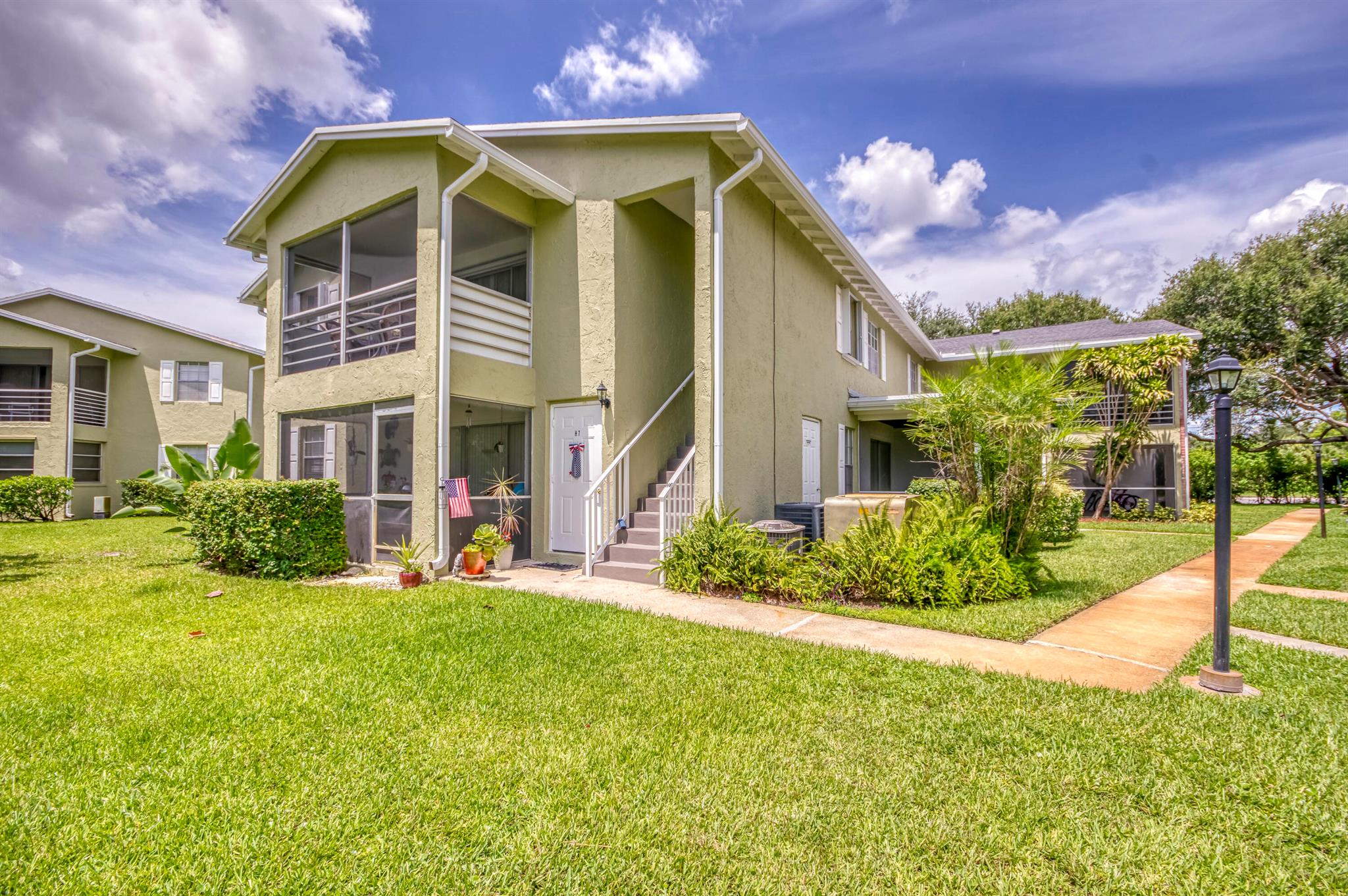 Updated and Move-In Ready! This super clean 2nd-floor apartment features a private entrance and a beautiful pool view in a highly desirable neighborhood close to everything. Recent upgrades include new wood-look vinyl flooring, indoor/outdoor carpeting on the patio, updated faucet and garbage disposal, new blinds with drapes, and fresh hardware including new locks and doorbell. Hurricane shutters recently installed for added security.Also, enjoy no water bill, it is is included in rent Enjoy low-maintenance living in a fantastic location with shopping, dining, and major roadways just minutes away!