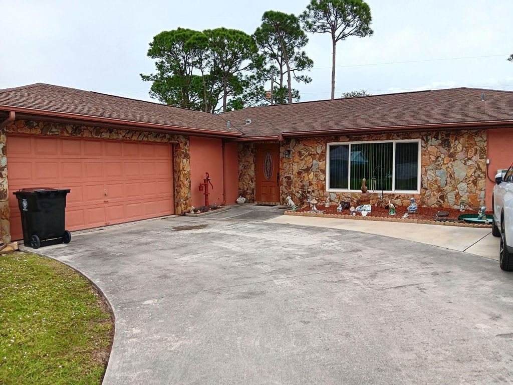 Photo of 1179 SE Proctor Lane, Port Saint Lucie, FL 34983 (MLS # R10944888)