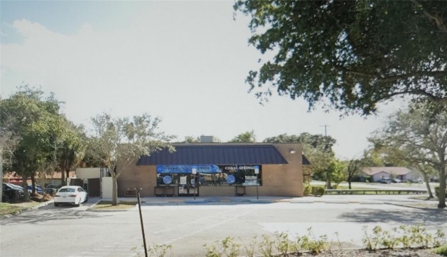 Corner Lot with 30,000 square feet. Access for 110 Avenue and Wiles Road. 50,000 cars per day and good visibility from E & W lanes on Wiles.
