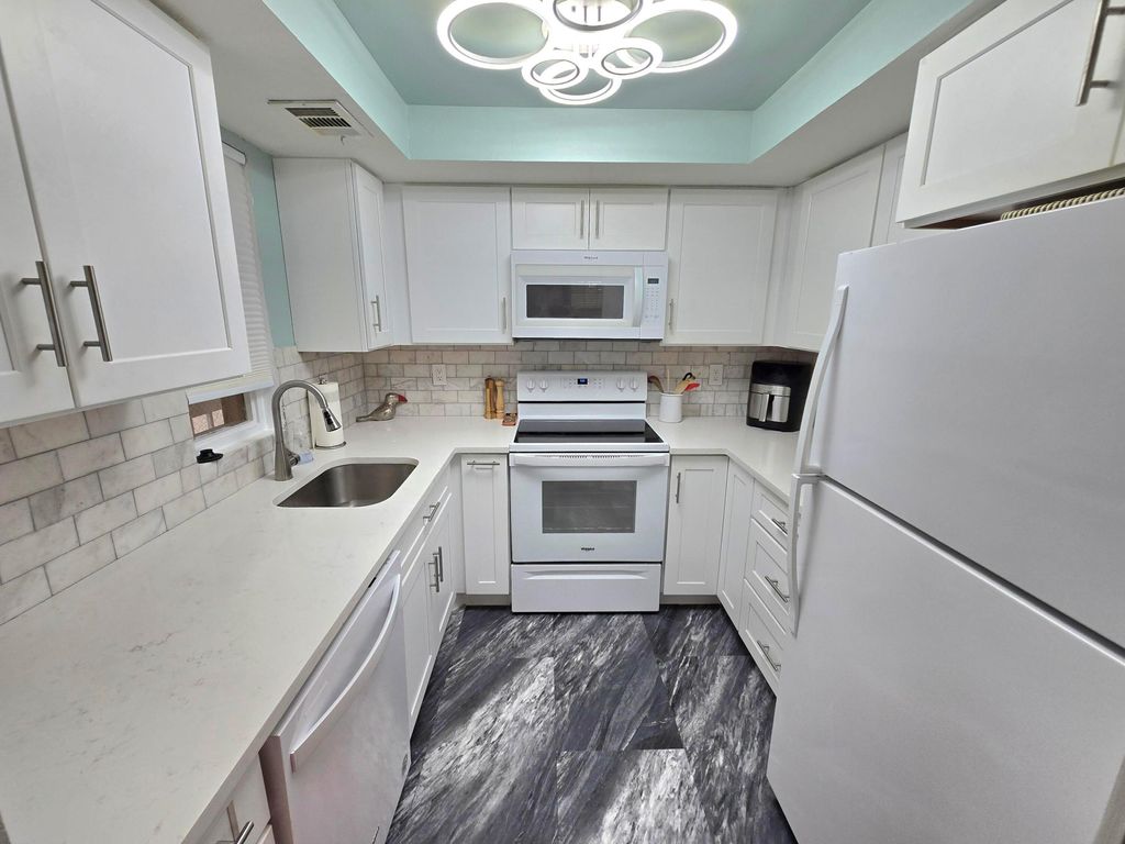 Photo of 1503 SE Royal Green Circle #201, Port Saint Lucie, FL 34952 (MLS # R11147076)