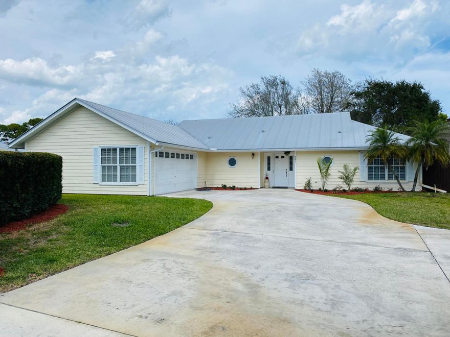 Here is your unique opportunity to own a beautifully maintained 3-bedroom, 2-bathroom home on NEARLY AN ACRE OF LAND in Town & Country Estates of Jensen Beach! No HOA. This property comes freshly painted and fully fenced with an oversized driveway, 2-car garage, metal roof, newer appliances, 2 sheds, and large screened-in private pool. In the backyard you will find mature fruit trees including mango, avocado, starfruit, and mulberry, in addition to lovely, flowering Crepe Myrtle and Lily of the Nile. Located less than 2 miles from downtown area shopping and dining and just 4 miles from Atlantic Ocean public beach access. Don't miss out! More photos to come.