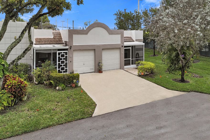 Beautiful private end-unit villa in the desirable Town Villas community of Boca Raton, featuring an extended floor plan and additional windows that fill the home with natural light. This tastefully updated residence offers high-impact windows throughout and a stunning leaded glass impact front door.  The updated kitchen features granite countertops, stainless steel appliances, and designer sink and fixtures. Washer, dryer, and dishwasher approximately 4 years old. Both bathrooms have been stylishly renovated with quality finishes.  Enjoy the convenience of a 1-car garage and the added privacy of an end unit. The cement roof is maintained by the HOA and was recently sealed within the past year. HOA includes cable, lawn maintenance, and exterior painting of the buildings.