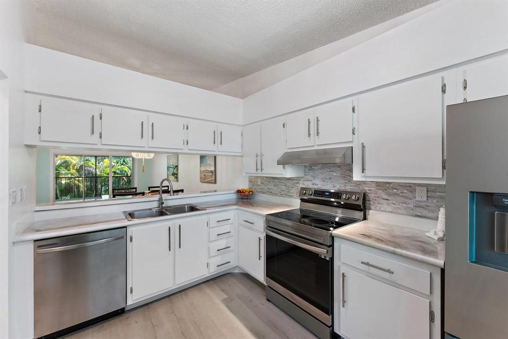 Photo of 1201 Sabal Ridge Circle #G, Palm Beach Gardens, FL 33418 (MLS # R10801874)