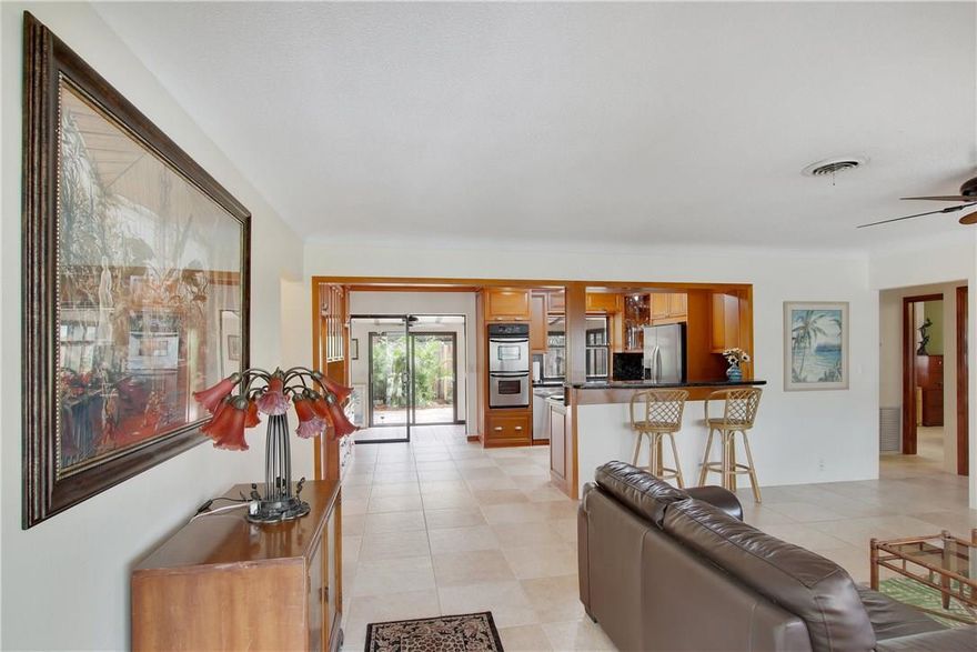 Incredible value east of US1! Well laid-out 3/2 floor plan with updates though out. Stainless steel appliances complement the custom wood cabinetry in the kitchen.  Ideal exposure & orientation yield plenty of natural sunlight throughout.  One of the few properties available in the area with garage space.  Property also features a separate laundry/utility room.   Backyard laid with pavers throughout ideal for entertainment.  Side entrance provides plenty of space for boat parking.  Check out the 3D tour!