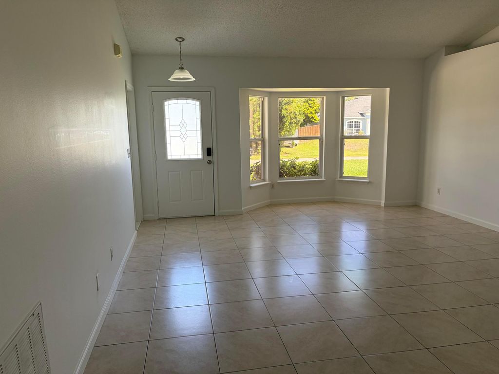 Photo of 1682 SW Glacador Avenue, Port Saint Lucie, FL 34953 (MLS # B26017297)