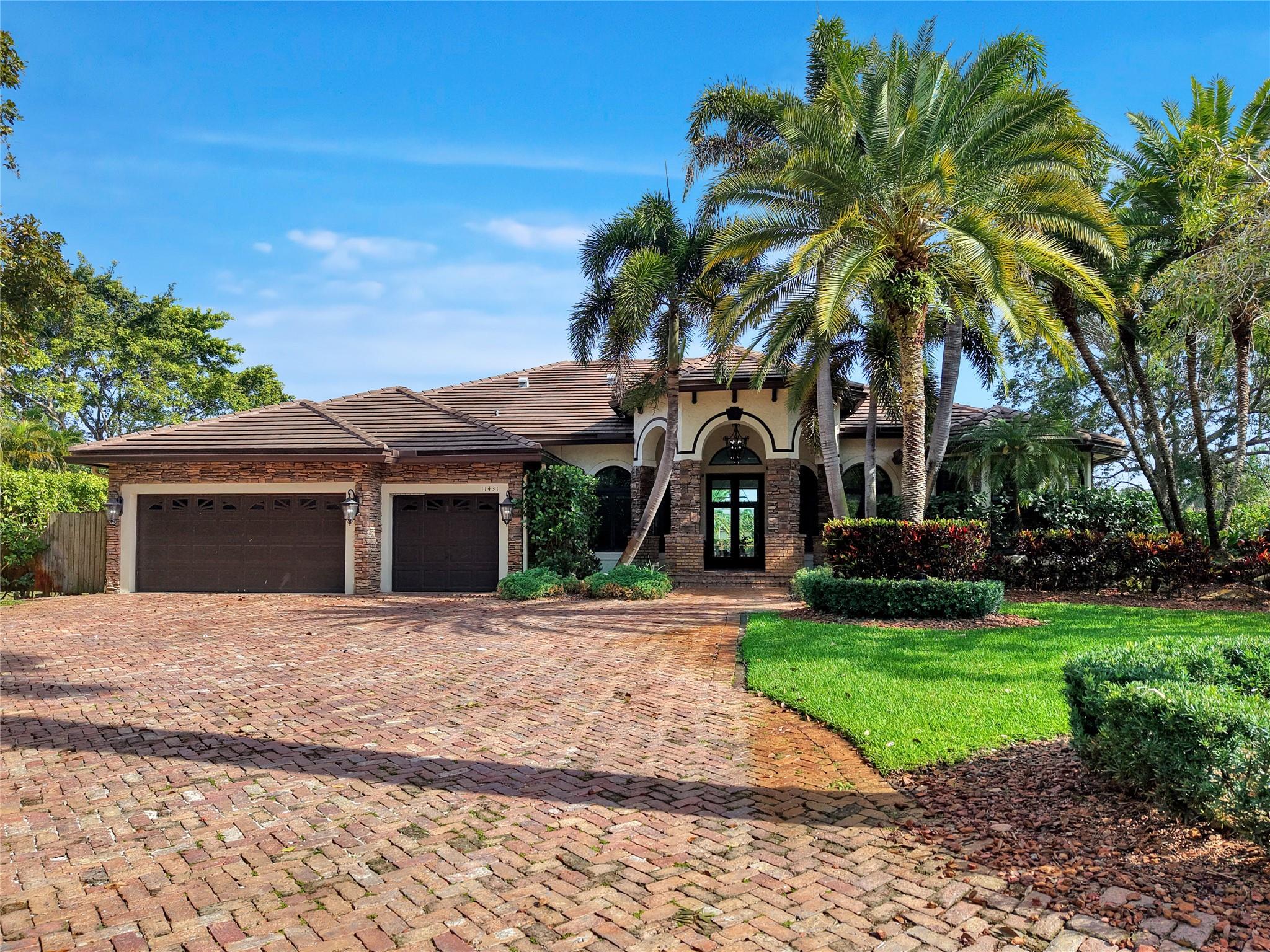 Stunning & truly turn key Plantation Acres Estate on a cul-de-sac has all the upgrades you've been looking for! Just under an acre deep lot! Updated kitchen featuring quartzite counters, double refrigerator & freezers, gas stove, large walk in pantry, wine/beverage cooler, pull outs w. electrical in cabinets. Bar w ice maker & wine cooler. Primary bedroom is spacious w seating area & access to patio. Brand new primary bath w custom vanities, dual shower heads, glass enclosure w free standing tub. Jack & Jill bathroom also brand new. All baths updated! All closets have built in cabinetry! 2021 Roof. Both ACs new. WH 2023 Washer/Dryer 2021. All impact windows! New paint & baseboards throughout. Dream backyard w pool & spa (new heater). New deck that overlooks your expansive yard!