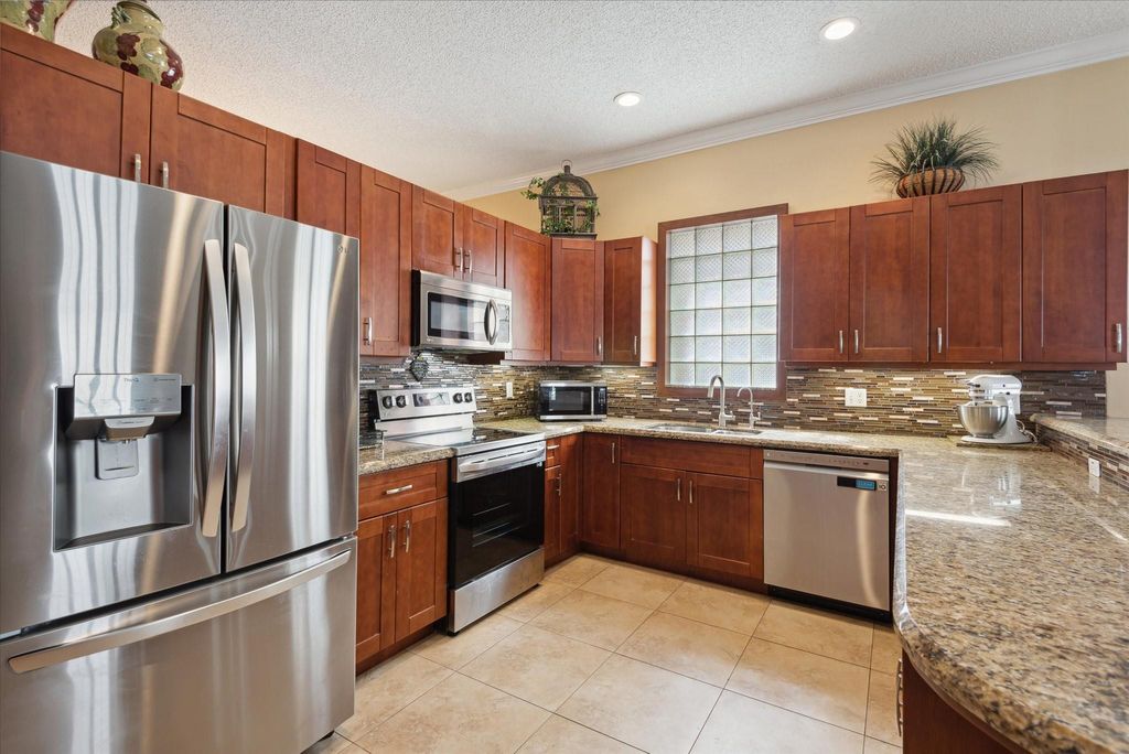 Photo of 5877 NW 73rd Court, Parkland, FL 33067 (MLS # F10422158)