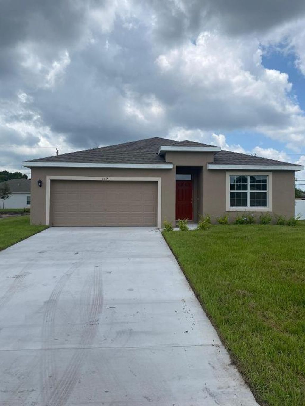 Photo of 1314 SW Goodman Avenue, Port Saint Lucie, FL 34953 (MLS # R10959242)