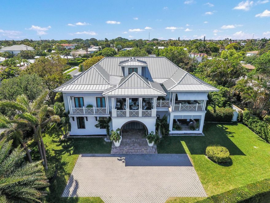Enjoy expansive views of Palm Beach and the intracoastal waterway from this spectacular home on South Flagler Drive. This recently renovated West Indies style home, with almost 3,000 sq. ft. outdoor living space offers spectacular water views from almost every room. The open floor plan is bright and airy offering a unique mix of indoor and outdoor living spaces. This West Indies style home offers five bedrooms, four baths, two half baths, full impact glass, high end appliances, high ceilings and a third floor playroom. Also a two car garage, deep water dock with two boat lifts, large swimming pool, and the finest interior and exterior finishes. On almost a half an acre corner lot, enjoy the lush tropical landscaping that gives this home a private compound feel. A must see!